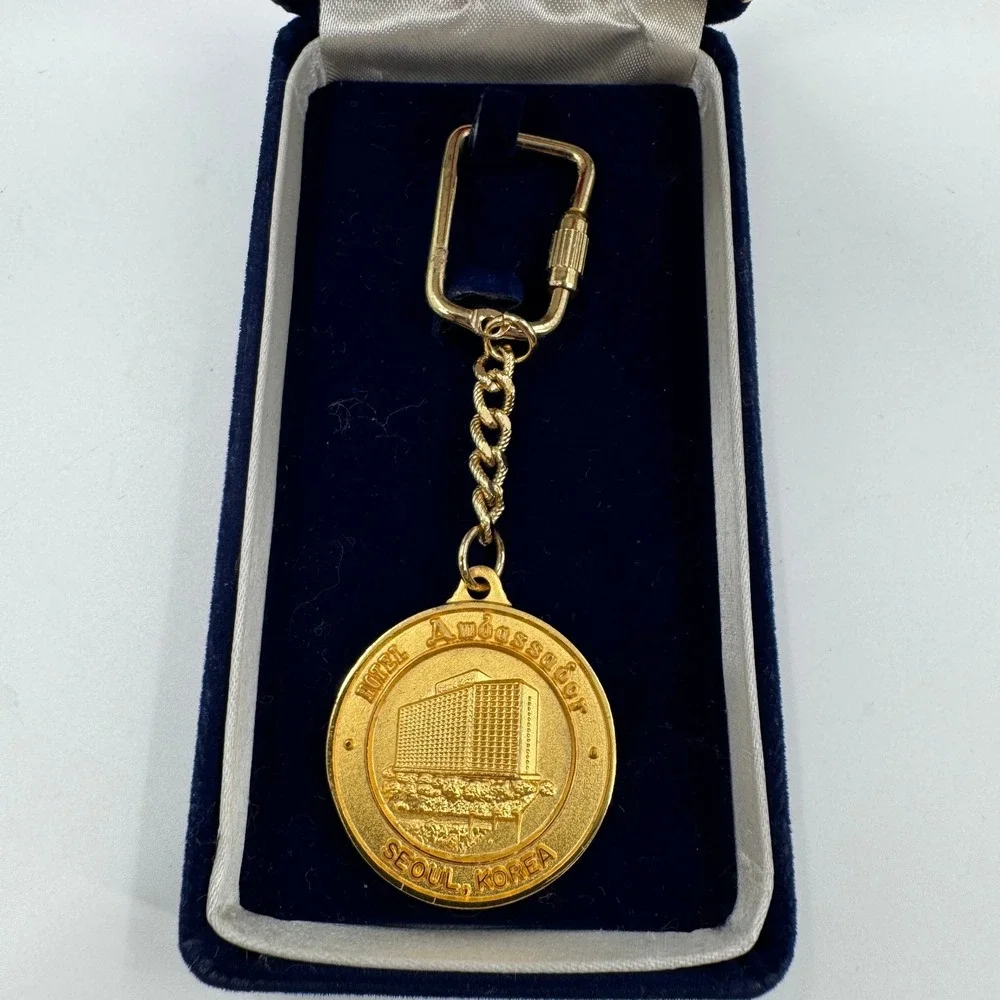 Vintage Hotel Ambassador Seoul Korea Gold Tone Medallion Keychain with Box